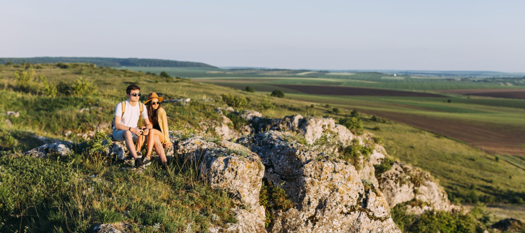couple-relaxing-rock-after-hiking